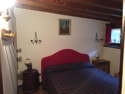 מיטה או מיטות בחדר ב-Rifugio tra i monti