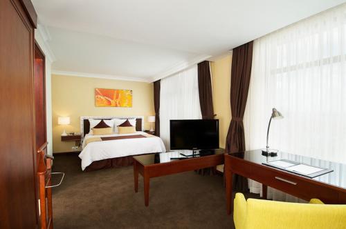 Ένα ή περισσότερα κρεβάτια σε δωμάτιο στο Vissai Saigon Hotel