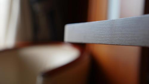 a close up of the back of a wooden bench at Hotel Rusadir in Melilla