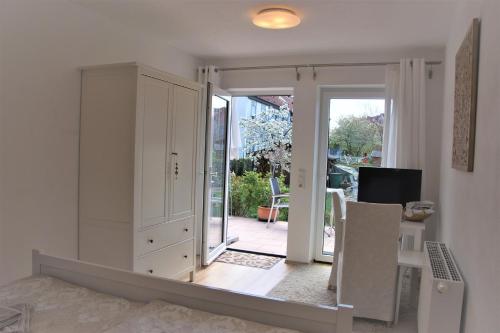 a living room with a mirror on the wall at Karuna Haus in Bad Windsheim
