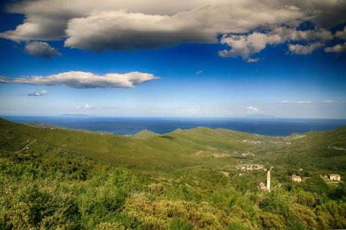 a view of the ocean from the top of a hill at Hôtel U Pozzu in Sisco