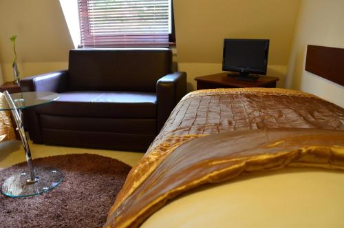 Un pat sau paturi într-o cameră la Camping Motel WOK
