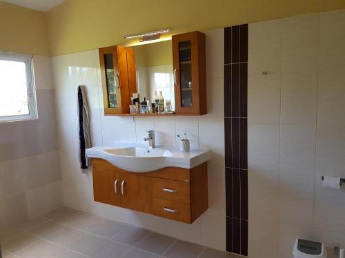 a bathroom with a sink and a shower at Caleton Group in Río San Juan