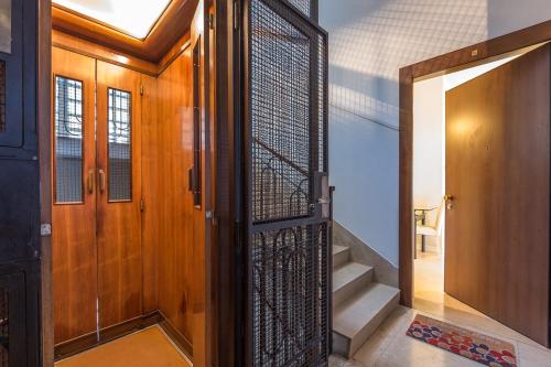 an open door with a metal gate in a hallway at Appartamento Masha in Venice
