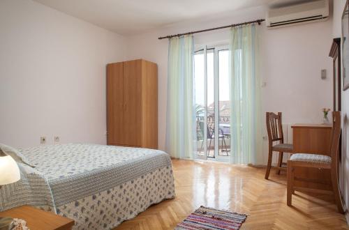En eller flere senge i et værelse på Apartments Cvjetni Dvori