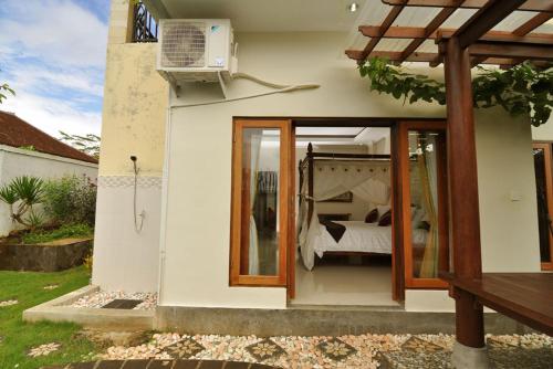 Ένα ή περισσότερα κρεβάτια σε δωμάτιο στο Kandava Villa