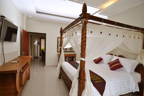 Ένα ή περισσότερα κρεβάτια σε δωμάτιο στο Kandava Villa