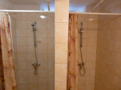 a bathroom with a shower with a shower curtain at Dom Studencki Atol in Krakow