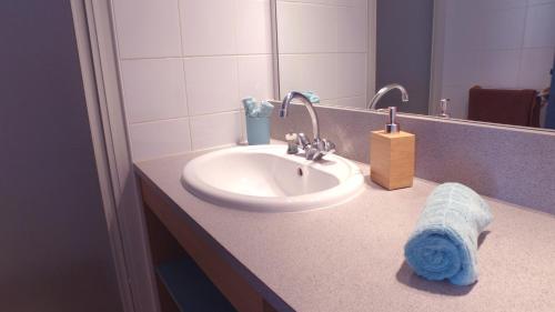 a bathroom sink with a towel on a counter at VVF Méjannes Gard in Méjannes-le-Clap