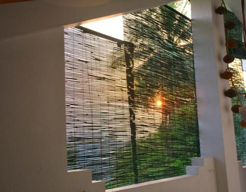 a large window with blinds in a room at Amsterdam Tourist Rest in Anuradhapura