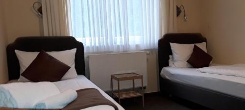 Ένα ή περισσότερα κρεβάτια σε δωμάτιο στο Lieth-Hotel-Grünreich
