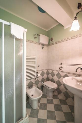 a bathroom with a toilet and a sink at Locanda Belvedere Da Stefano in Rocchetta a Volturno
