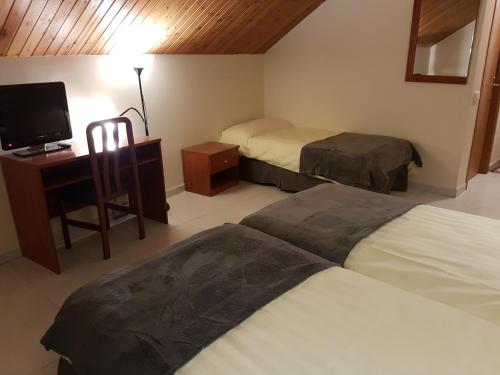 Postel nebo postele na pokoji v ubytování Hotel Guineu