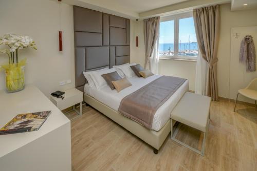 Posteľ alebo postele v izbe v ubytovaní Hotel Villa Garuti