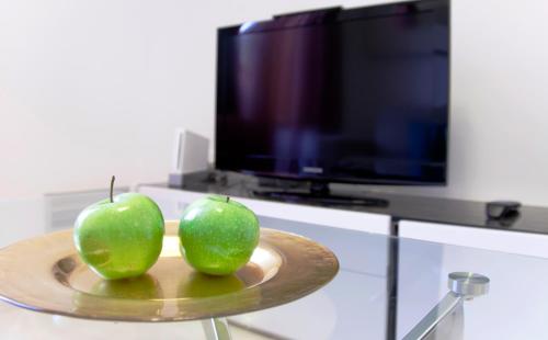 TV a/nebo společenská místnost v ubytování BiBo Suites Gran Vía