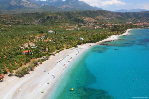 an aerial view of a beach with people on it at Melitsina Village Hotel in Kardamili