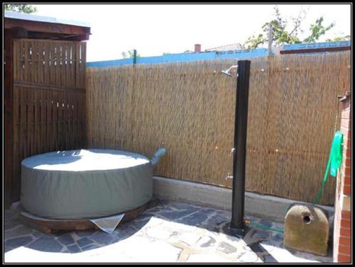 a bath tub sitting in front of a fence at Vinarstvi Radim Mildner in Podivín