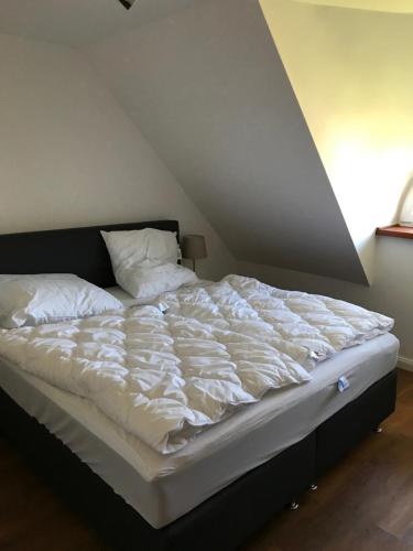 Voodi või voodid majutusasutuse Ferienhaus Nordwind toas