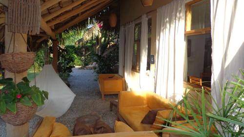 a living room with a couch and some plants at Residencia El Balatà in Las Terrenas