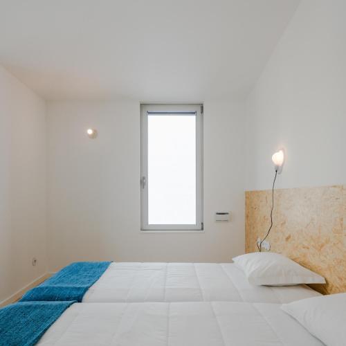 Hostel Conii & Suites Algarveにあるベッド