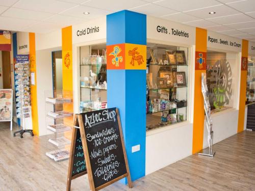 a store with colorful walls and a sign in front of it at TLH Toorak Hotel - TLH Leisure, Entertainment and Spa Resort in Torquay