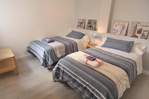 A bed or beds in a room at Noches de ensueño