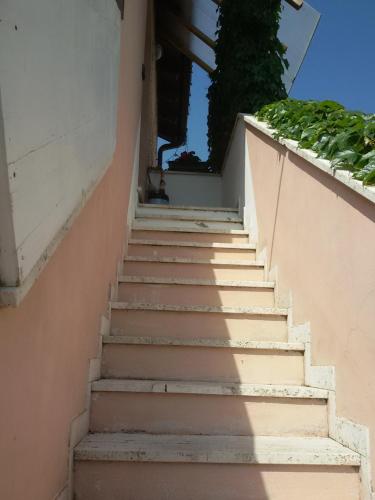 a set of stairs leading up to a building at Ciro BED AND BREAKFAST la villetta in Pioltello