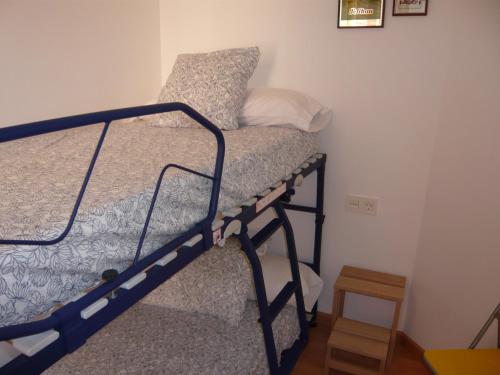 a bedroom with two bunk beds in a room at Apartament Conde Güell in Barcelona