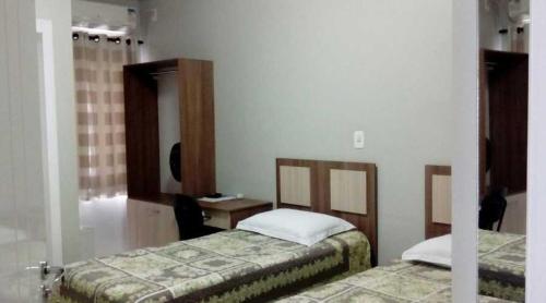 Un ou plusieurs lits dans un hébergement de l'établissement Hotel Descanso