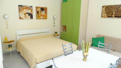 a bedroom with a bed and two tables at Lusso accessibile e Servizi in Lerici