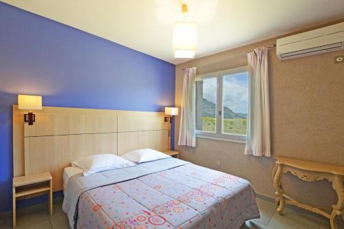 Postel nebo postele na pokoji v ubytování Hôtel la Palma