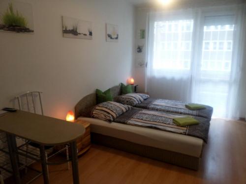 A bed or beds in a room at Apartments Leslie