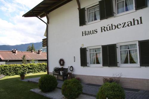 a building with a sign on the side of it at Das Ruebezahl in Reit im Winkl