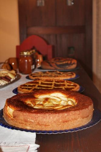 a table topped with three different types of bread at Agriturismo Castello Di Belforte in Todi