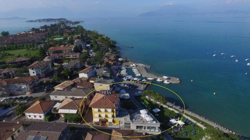 an aerial view of a small town on the water at Hotel Ca' Serena in Sirmione