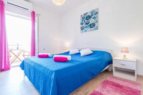 Postel nebo postele na pokoji v ubytování Apartments Windrose