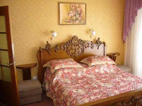 Säng eller sängar i ett rum på Hotel Profspilkovyi