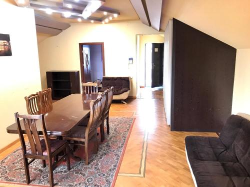 a dining room with a table and chairs at Tatev Apartments in Yerevan
