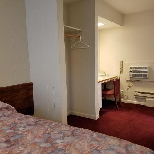 Postel nebo postele na pokoji v ubytování Greenwell Motel