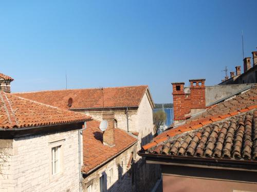 a group of buildings with red roofs at Apartment Old Town in Pula