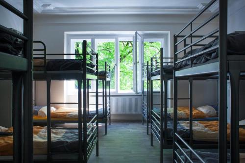 a room with a bunch of bunk beds at Hostel Fontána in Prague