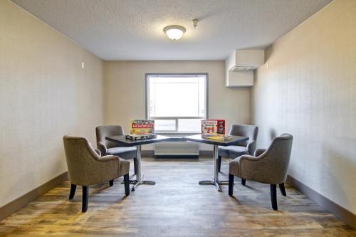 a conference room with a table and chairs at Canalta Brooks in Brooks