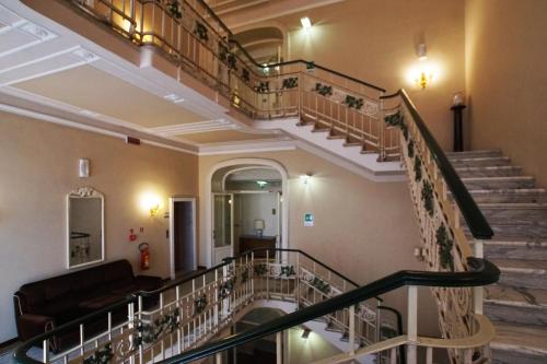 an image of a spiral staircase in a building at Grand Hotel Regina Salsomaggiore in Salsomaggiore Terme
