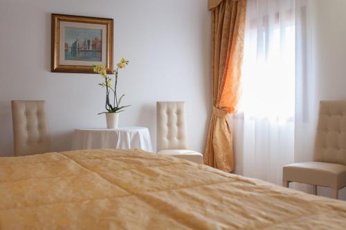 Ένα ή περισσότερα κρεβάτια σε δωμάτιο στο Ca' Cappellis