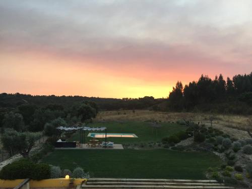 a view of a park at sunset at Casa do Alfaro in Azambuja
