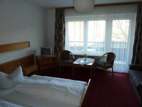 Posteľ alebo postele v izbe v ubytovaní Alpenhotel Beslhof