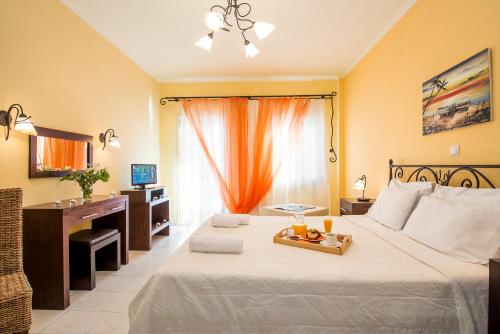 Ένα ή περισσότερα κρεβάτια σε δωμάτιο στο Kostis Villas