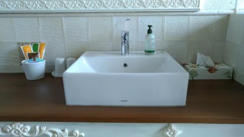 a white sink with a bottle on top of it at Charmole in Wujie