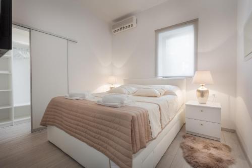 Ένα ή περισσότερα κρεβάτια σε δωμάτιο στο Modern Apartman Pjero
