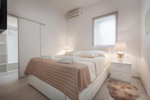 Posteľ alebo postele v izbe v ubytovaní Modern Apartman Pjero